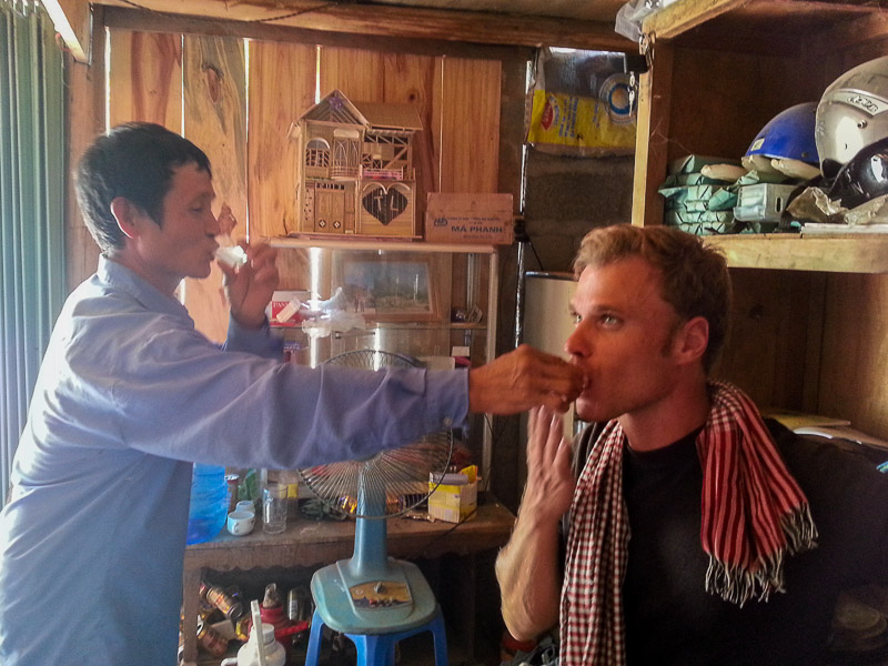 A local road stop for lunch. The locals invited me for a few shots of rice wine. One of these experiences ... (Vitenam)